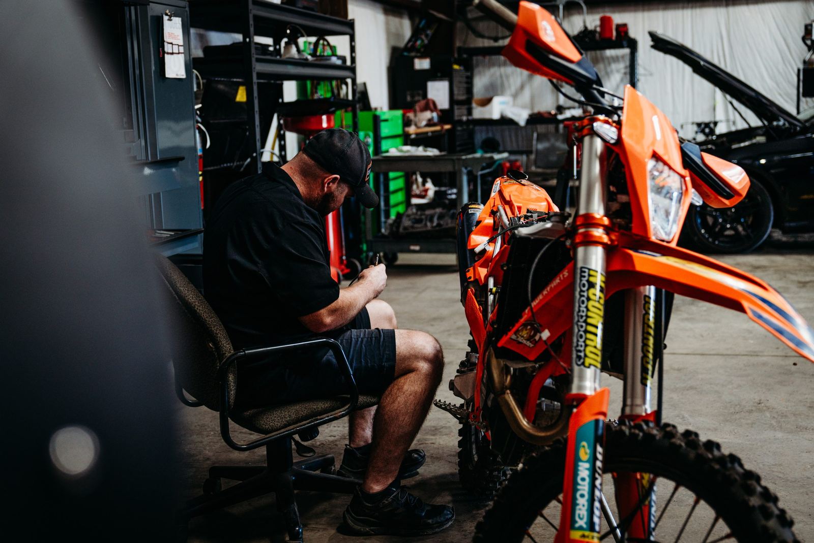 Technician working on a KTM in the shop