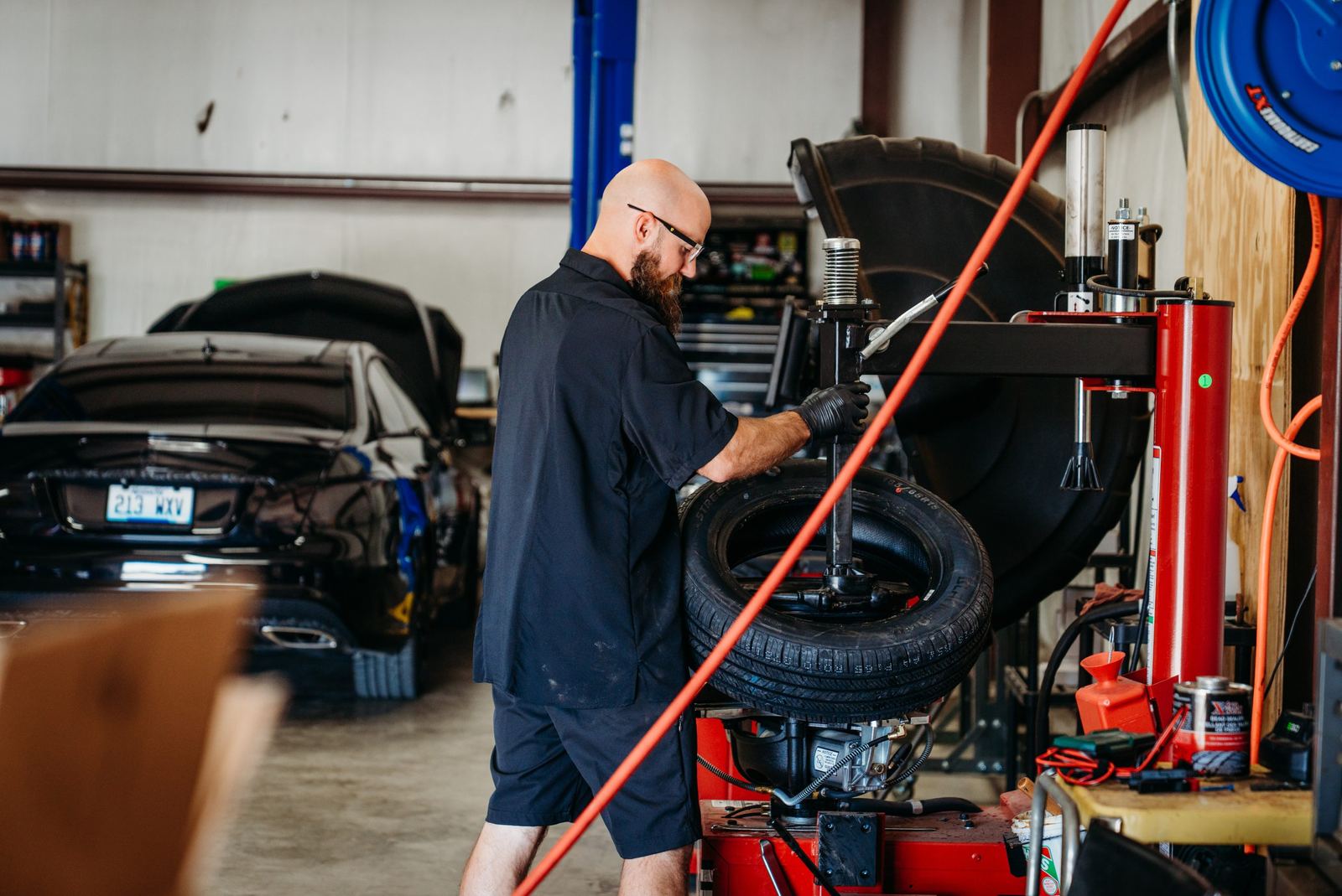 Technician mounting a tire
